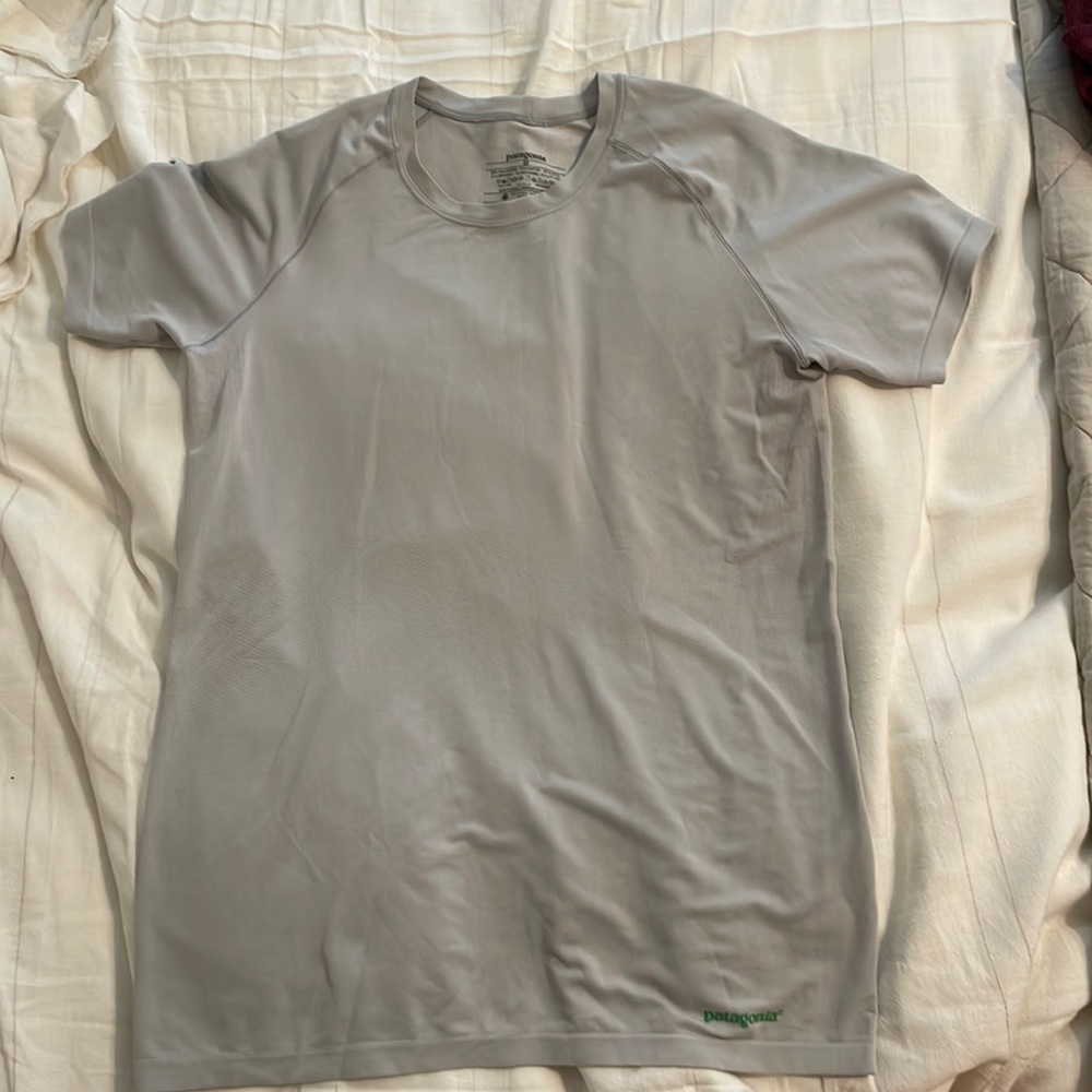 Two Patagonia cooling baselayer t-shirts.